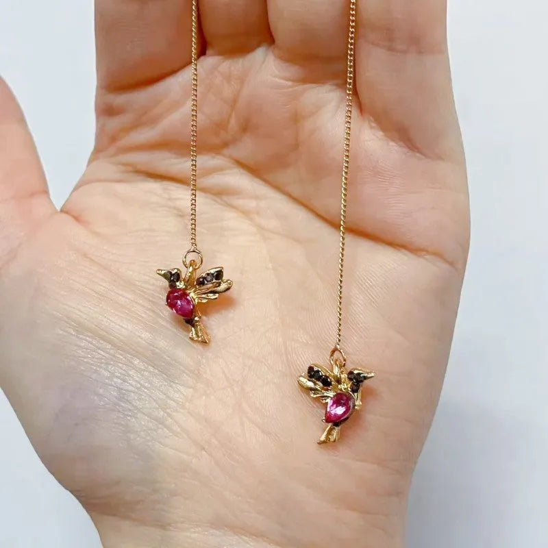 Long style hanging earrings featuring a bird design with mixed zirconium wings in red and blue electroplated alloy