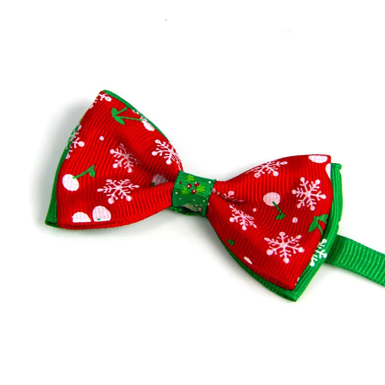 Handmade ribbon dog bow tie in nine colours with adjustable 20-26cm neck loop on a small dog