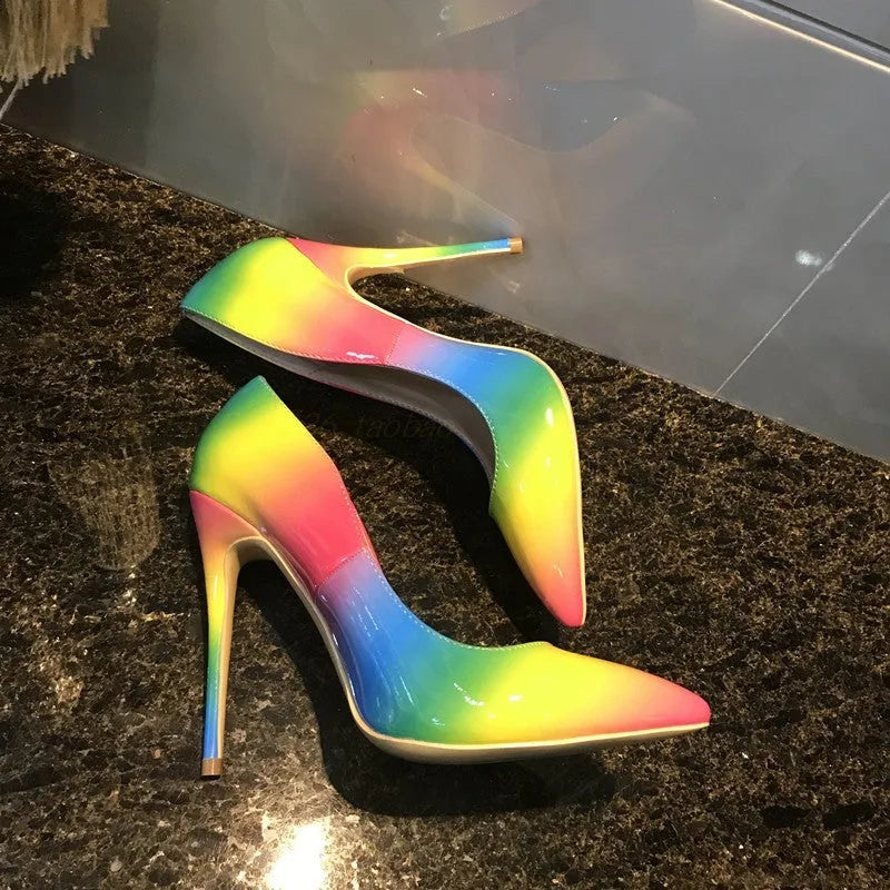 Rainbow coloured patent leather women's high heels with pointed toe and thin ultra-high heel.