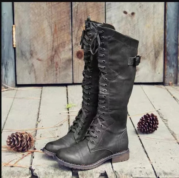 Women's black casual high-leg boots with a chunky low heel and round toe.