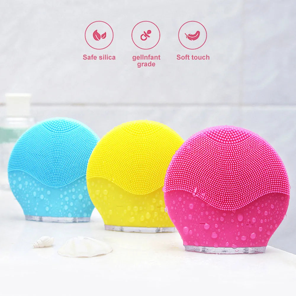 Electric waterproof silicone mini facial cleansing brush in pink with USB charging cable