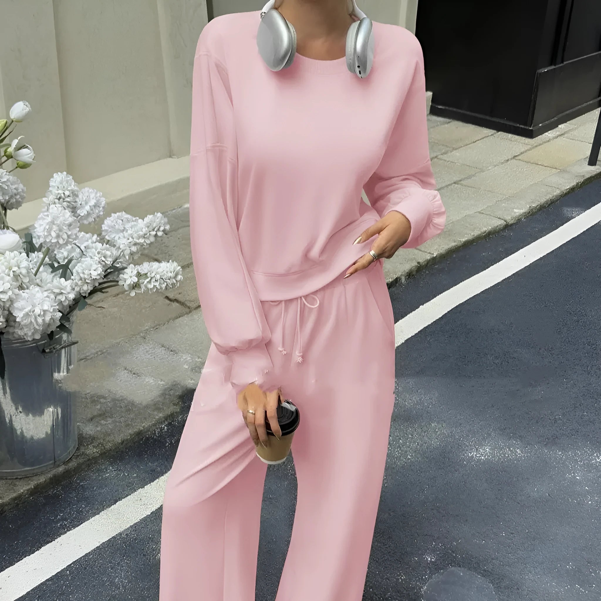 Women's solid colour polyester trouser set with long sleeve top, shown in apricot colour.