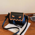Orange PU crossbody bag with pumpkin cartoon shape and small wings, placed on a neutral background