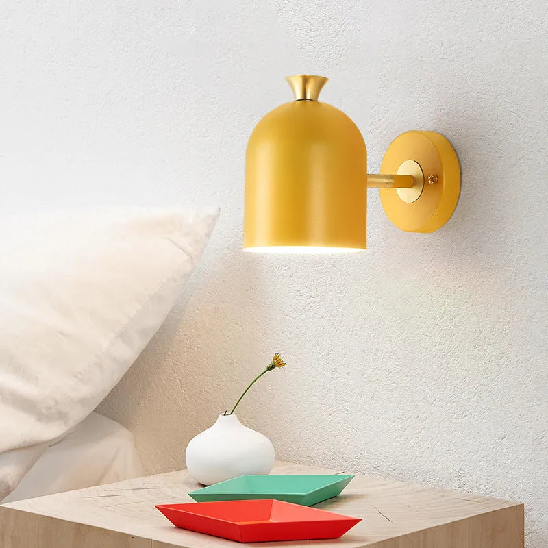 Single-head aluminium wall lamp with mirror front in choice of yellow, green, blue, or pink light.