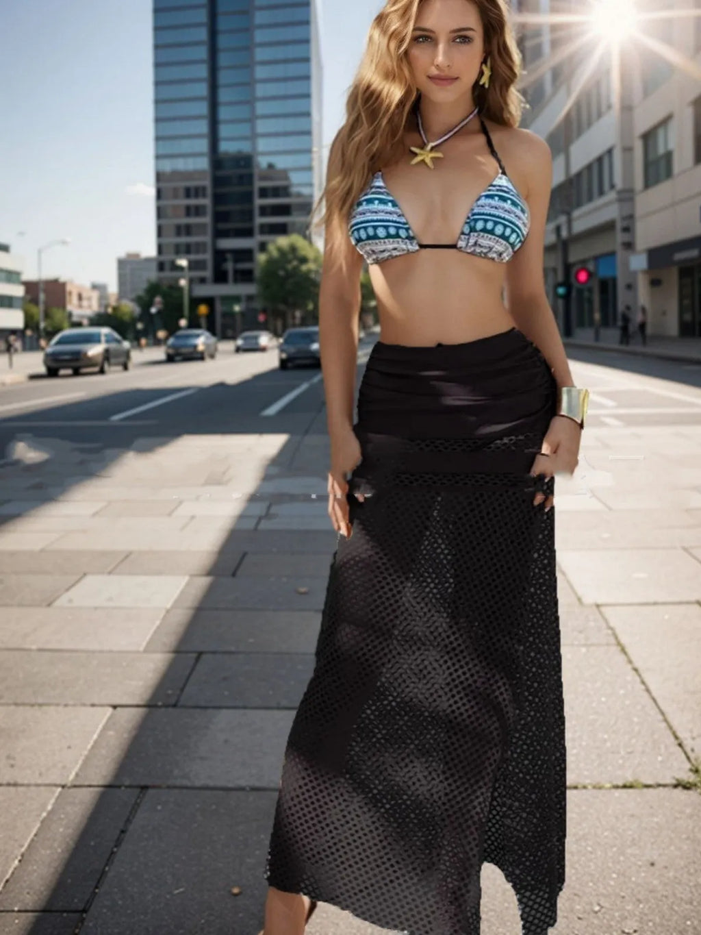 Women's three-piece swim set with bikini and long fishnet skirt in a gradient pattern.
