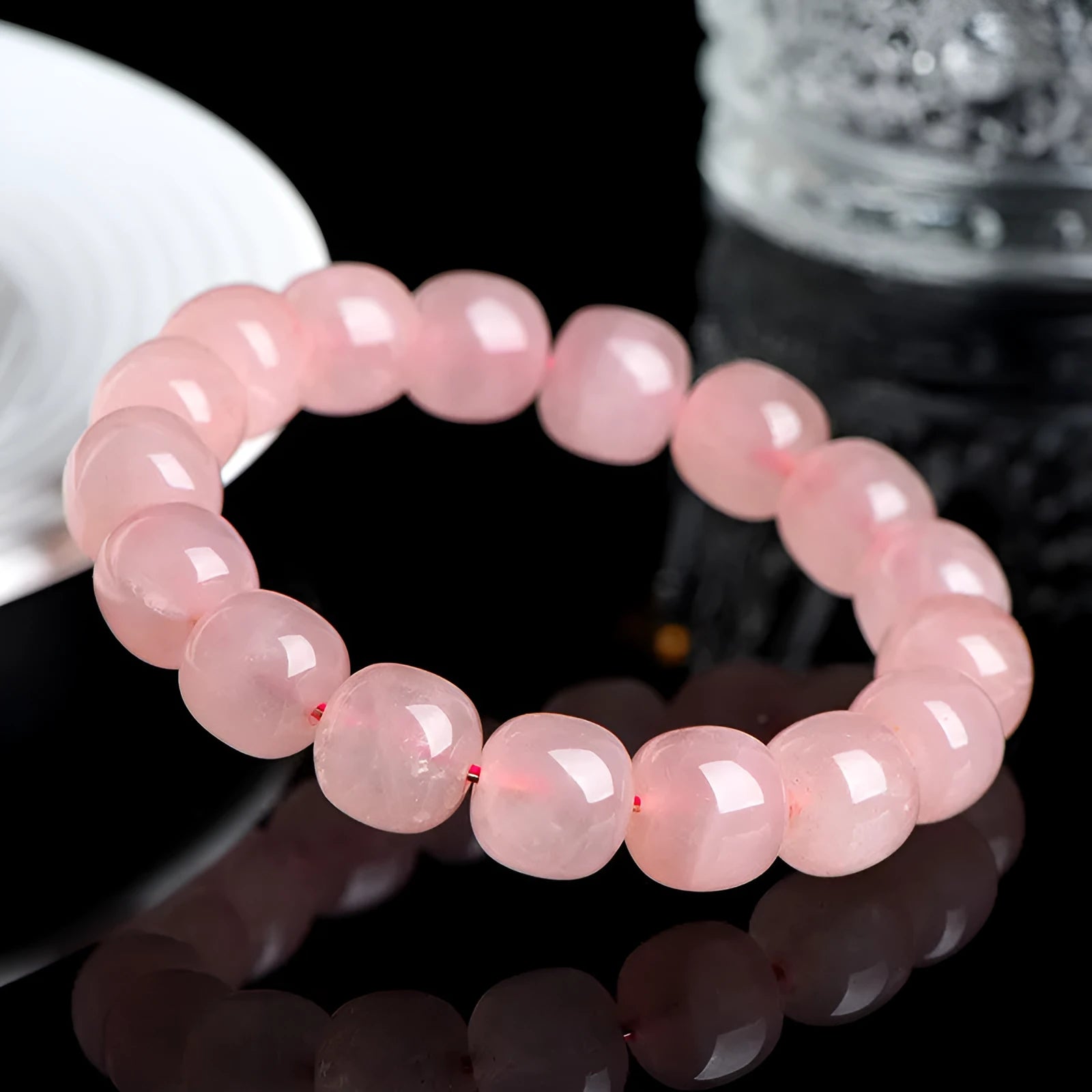Pink natural crystal bracelet with barrel shaped beads in geometric design