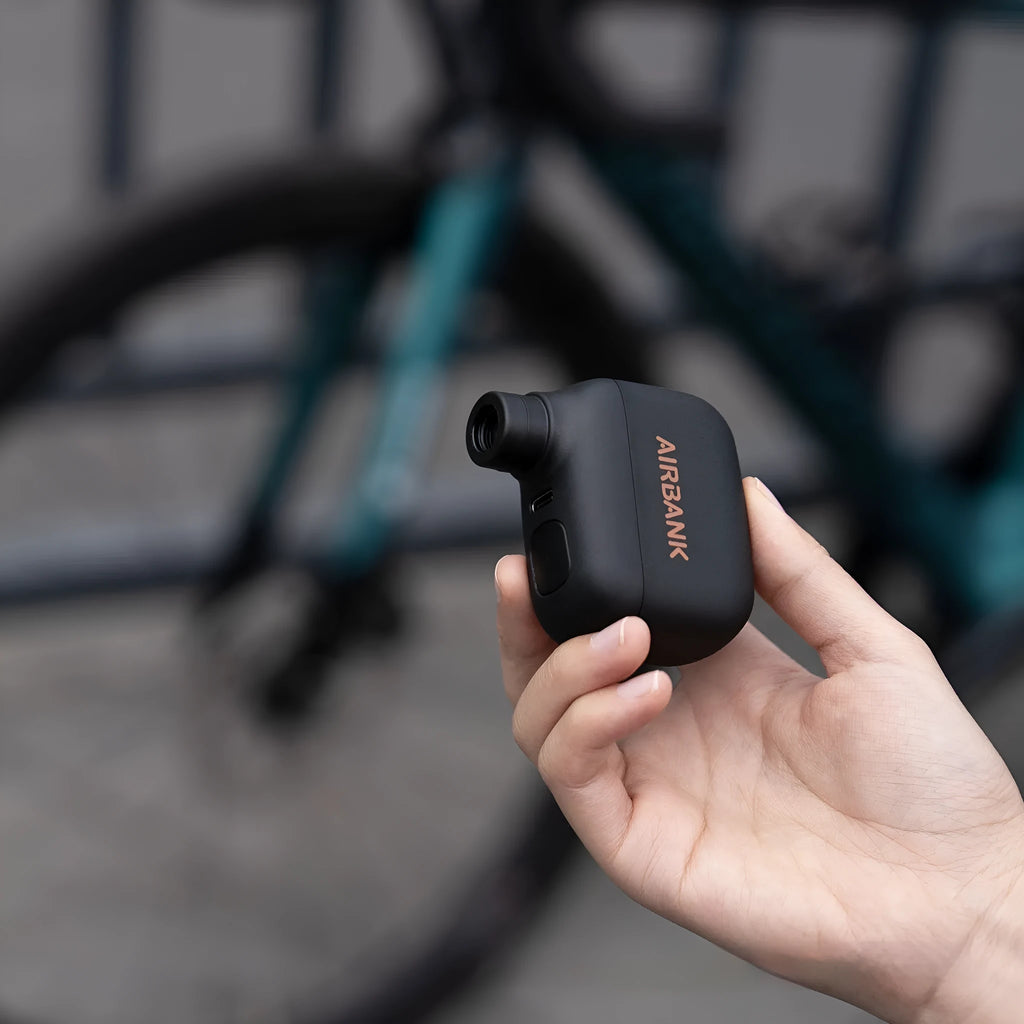 Black AS100 mini electric blast pump for mountain bike tyre inflation with USB charging cable