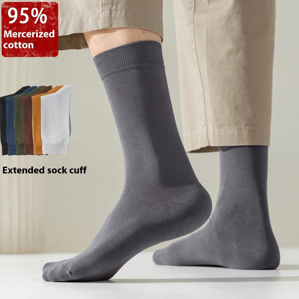 A pair of men's solid colour mid-calf socks made from combed cotton for business wear.