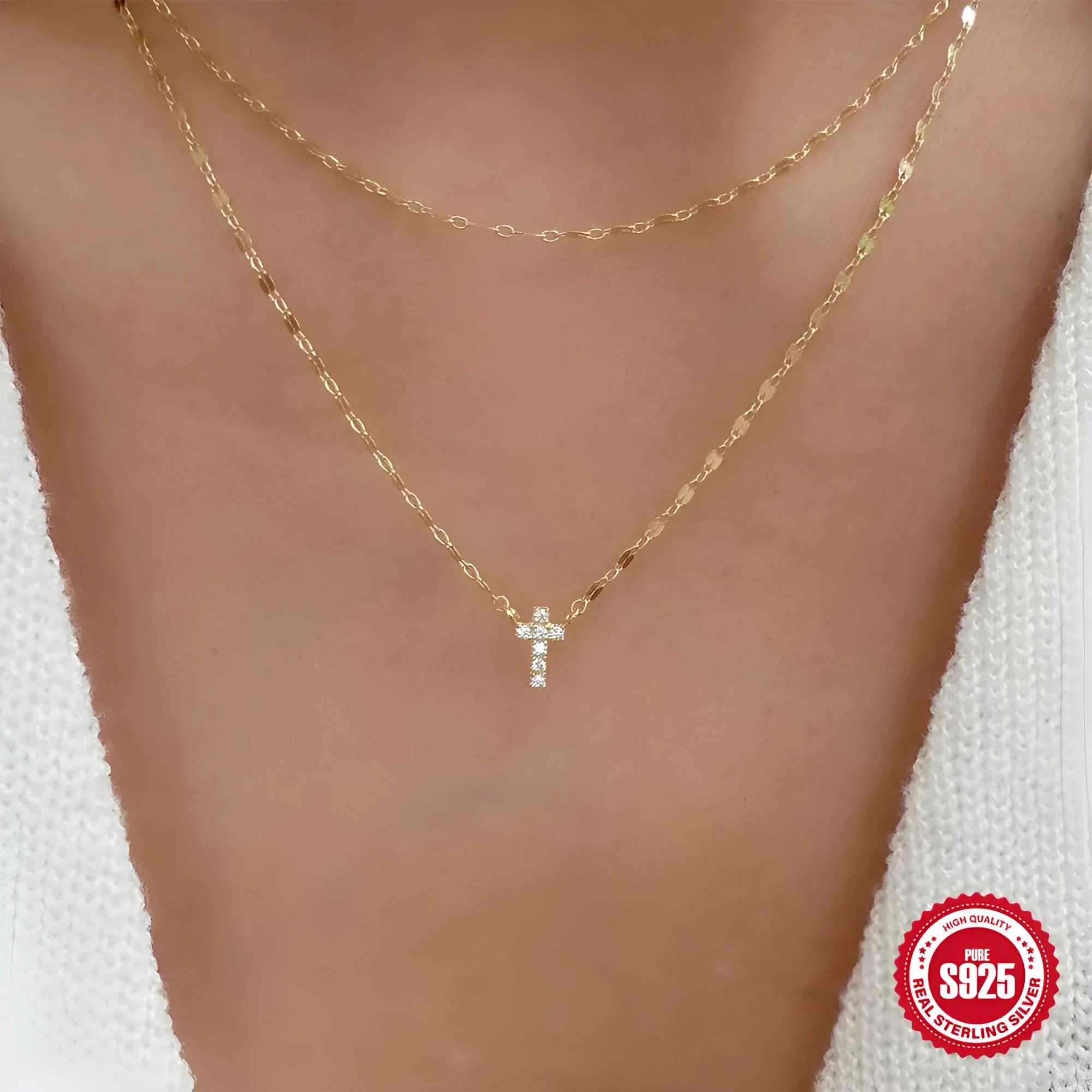 Sterling silver double layer twin diamond cross necklace on a clavicle chain, shown in gold tone.