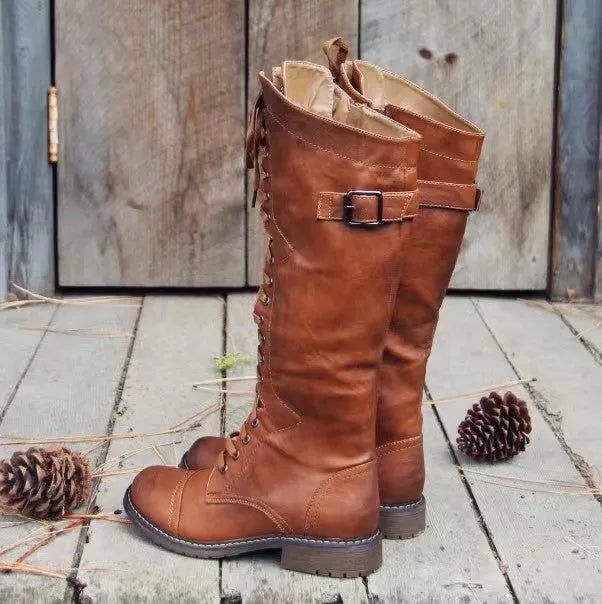 Women's black casual high-leg boots with a chunky low heel and round toe.