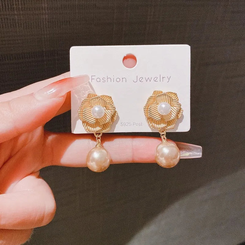 Gold Hong Kong style floral stud earrings with pearl and opal decoration