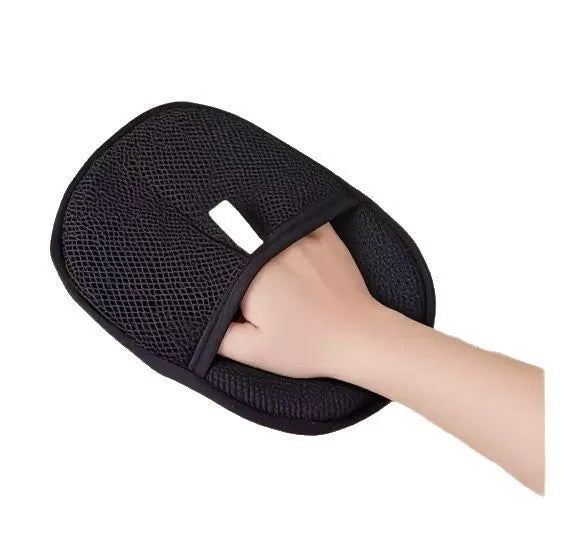 Black pet hair removal glove with silicone bristles for grooming dogs, cats, and rabbits.