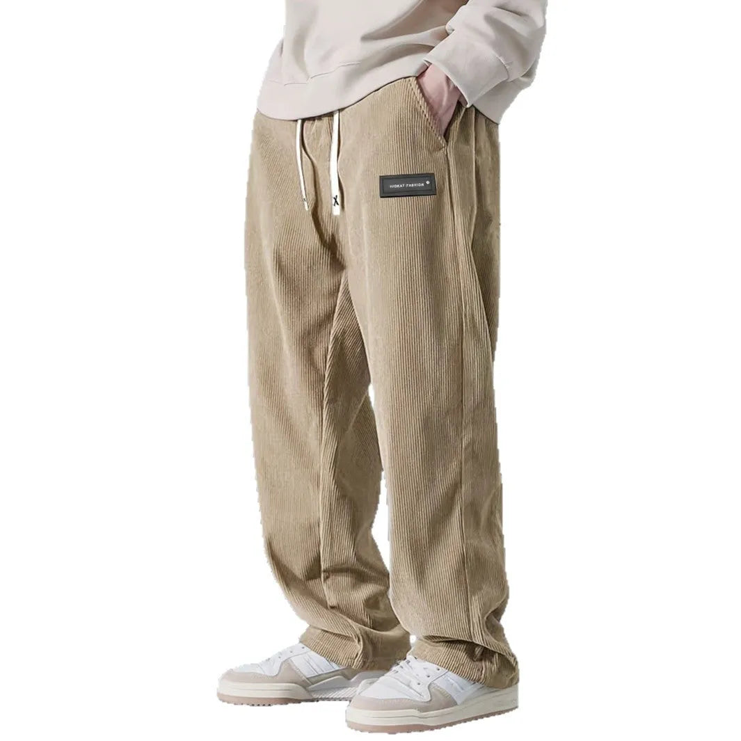 Men's corduroy straight-leg trousers in khaki with drawstring waist on a model, front view