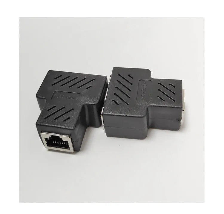 Two white RJ45 network cable splitter adapters showing three ports each.