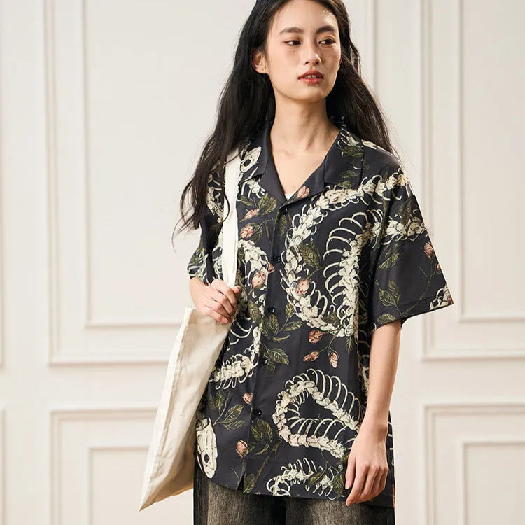 Men's short sleeve Cuban collar shirt featuring a snake bone and floral printed pattern in a loose fit.