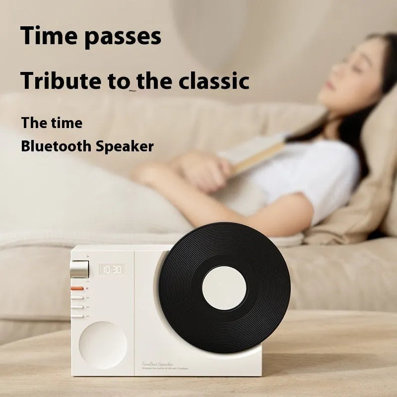 Mini Bluetooth portable speaker in obsidian black, ivory white, coral pink or plum green colours with USB charging