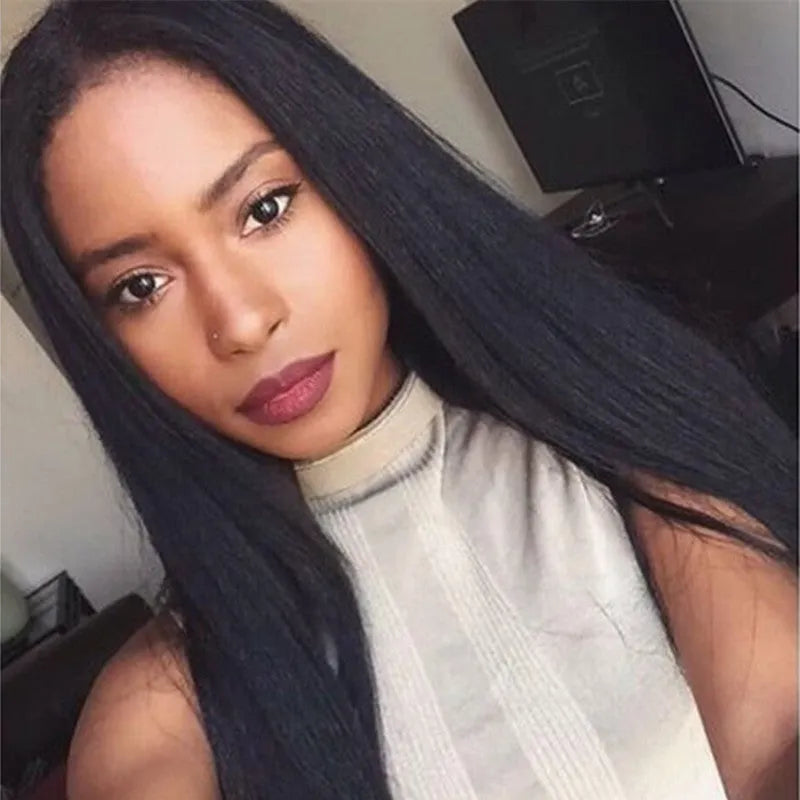 Long straight black synthetic wig with centre parting and fringe on a mannequin head.