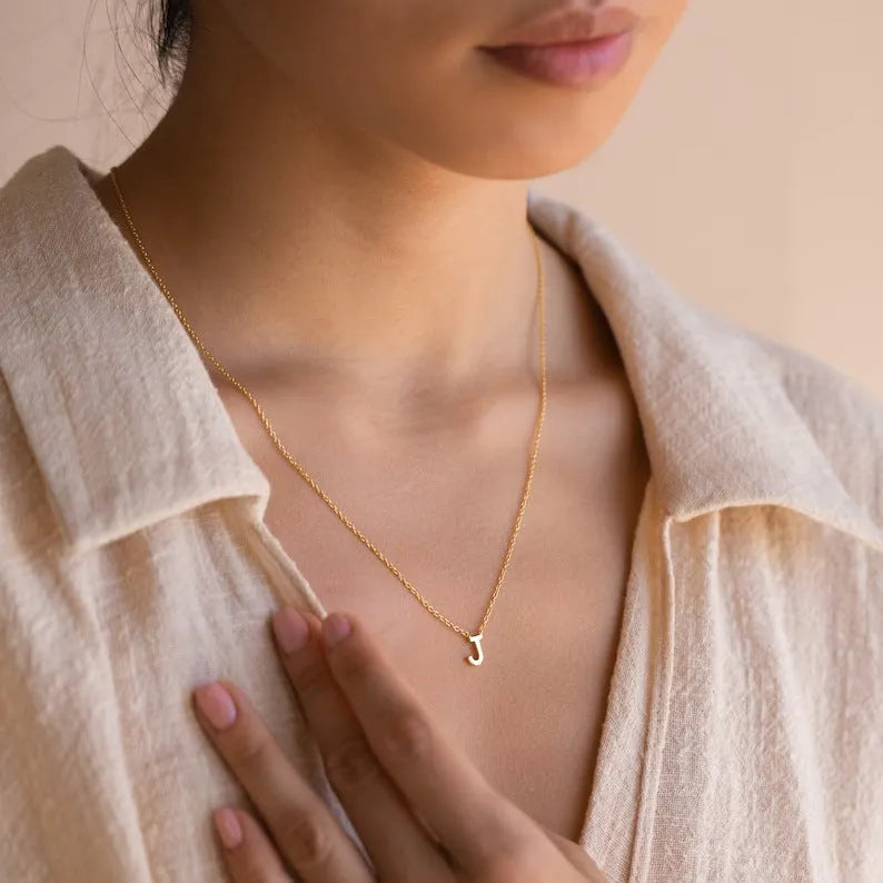 Stainless steel letter necklace with mixed gem inlaid pendant on an adjustable O-ring chain in silver finish
