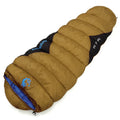Outdoor cotton sleeping bag in army green with its compression sack, shown partially rolled.