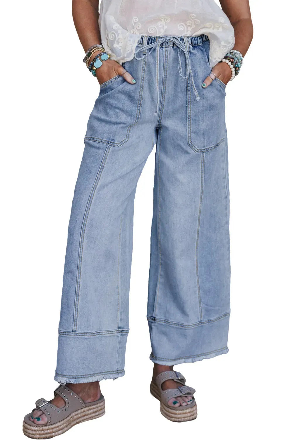 Beau blue women's wide-leg denim jeans with drawstring waist detailing and raw unfinished hem.