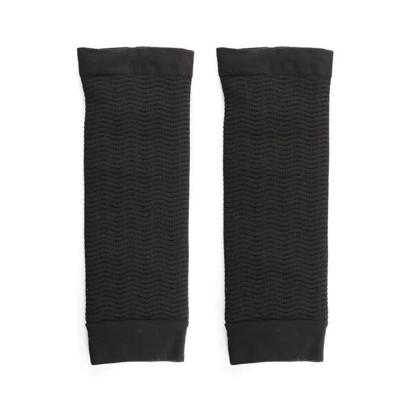 Pair of women's black nylon shaping sleeves for upper arm coverage.
