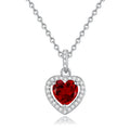 Women's sterling silver heart pendant necklace with natural gemstone on a cross chain.