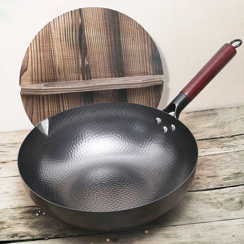Black handmade traditional iron wok with wooden handle, 32cm diameter with lid.