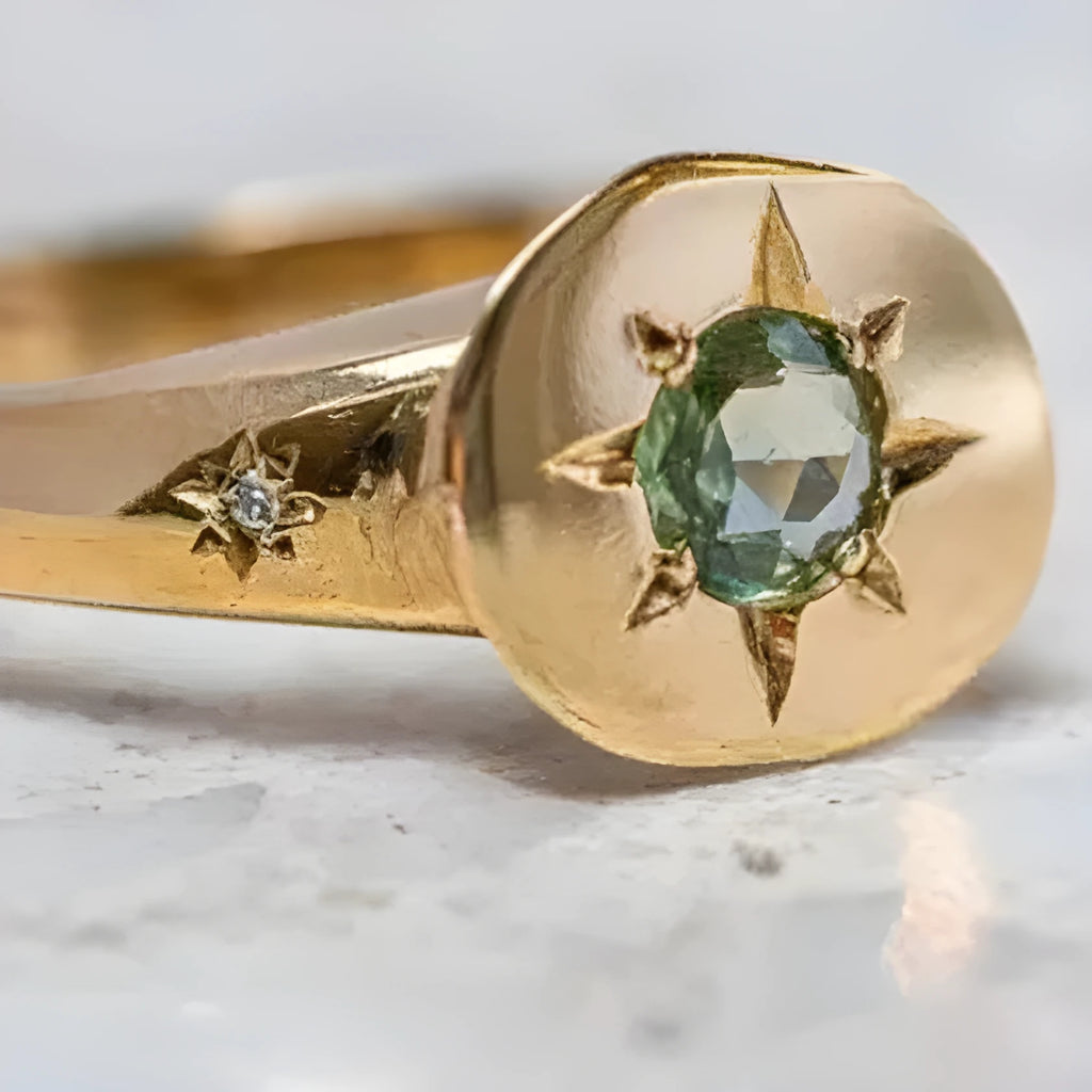 Golden adjustable ring with oval face featuring detailed star inlay design
