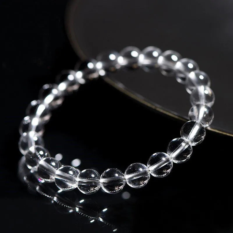 Natural Donghai Old Mine white crystal round bead bracelet on a wrist, showing geometric single circle design.