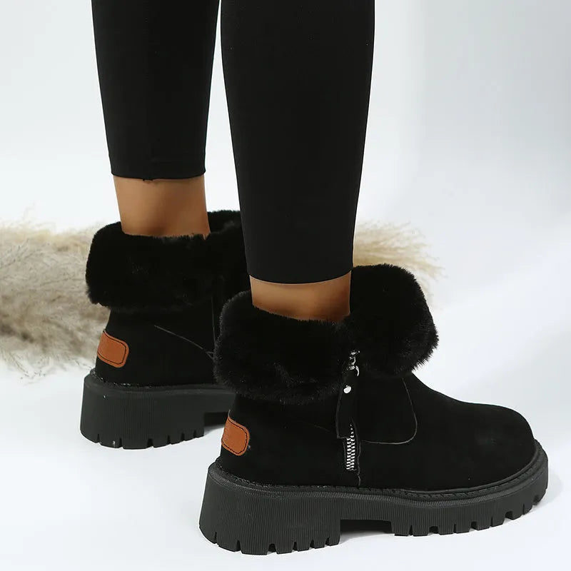Women's black faux suede high-top snow boots with a side zipper and thick plush lining.