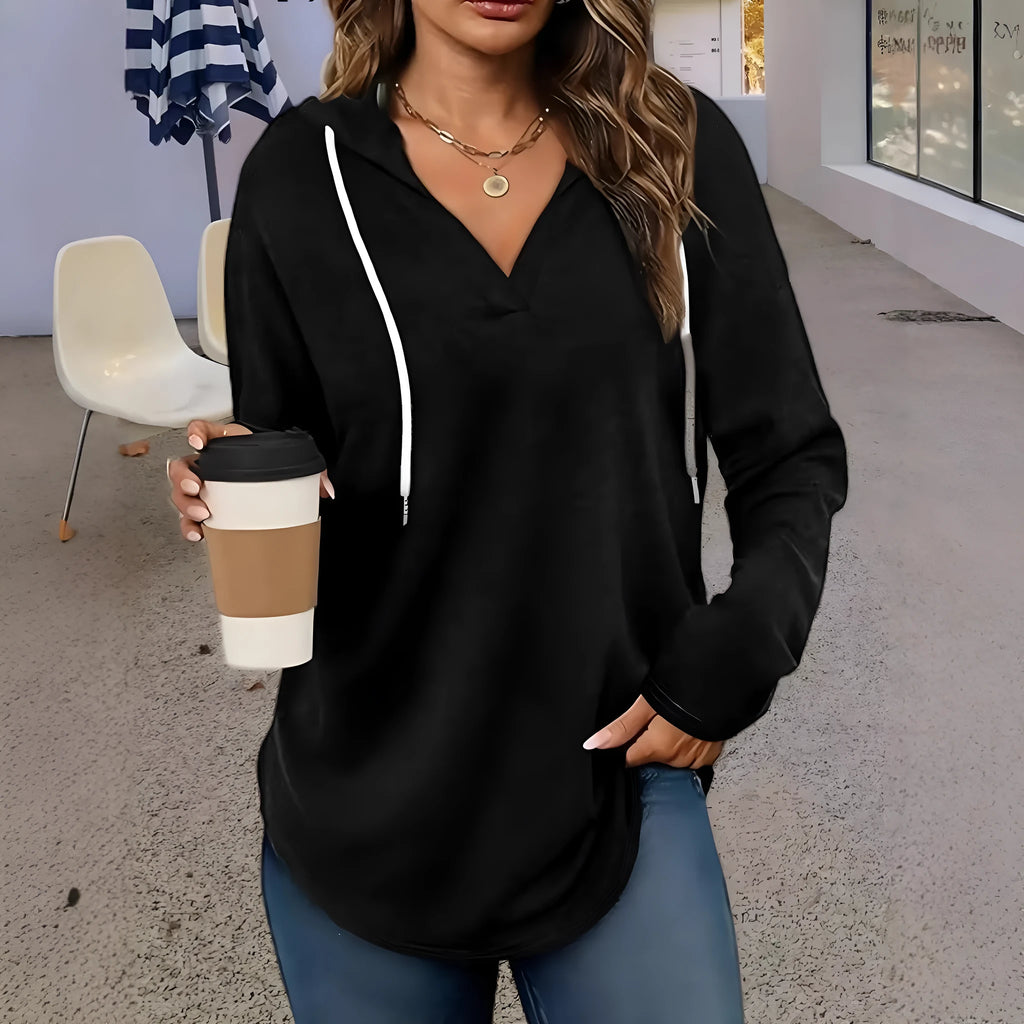 Red women's V-neck sweatshirt with a hood and long sleeves laid flat.