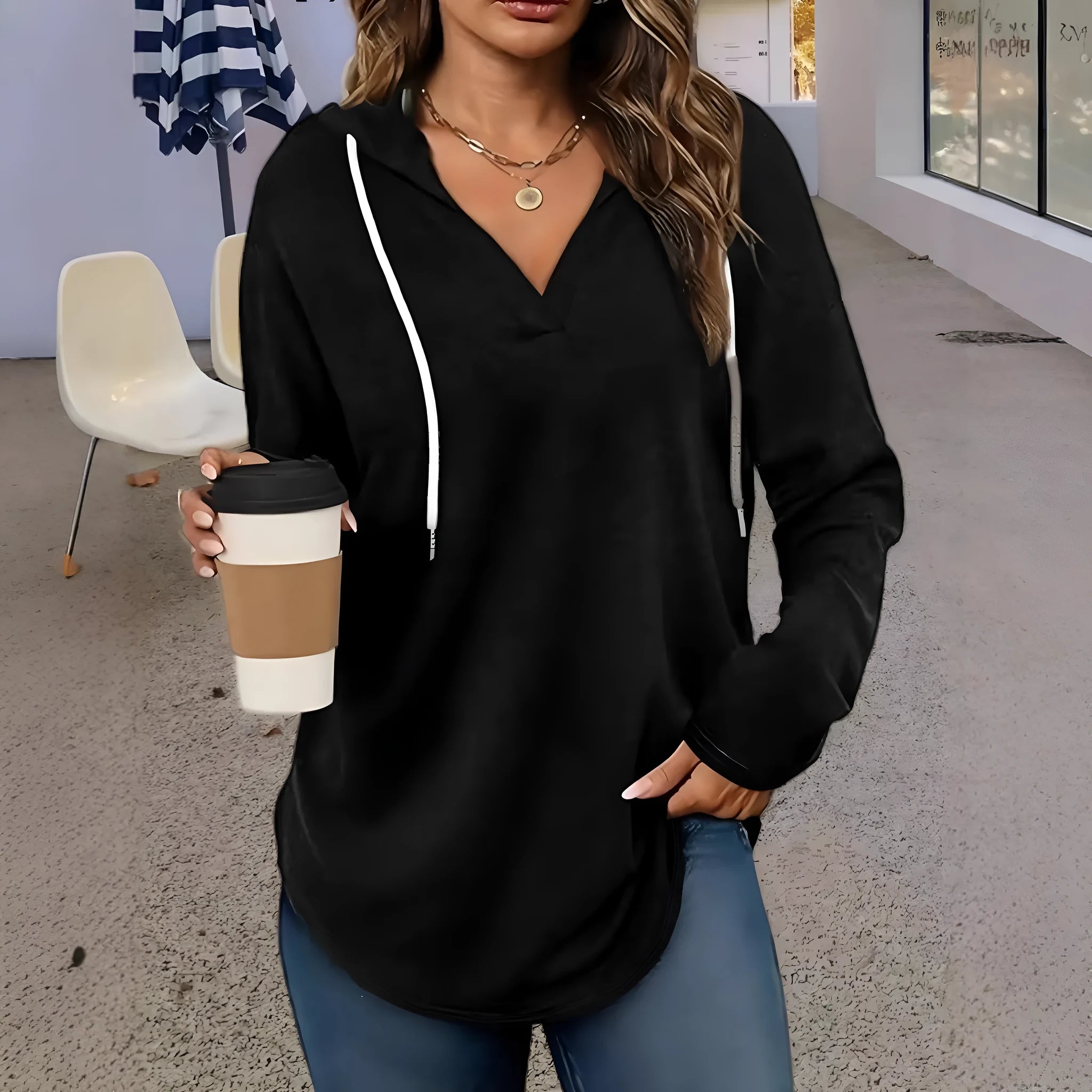 Red women's V-neck sweatshirt with a hood and long sleeves laid flat.
