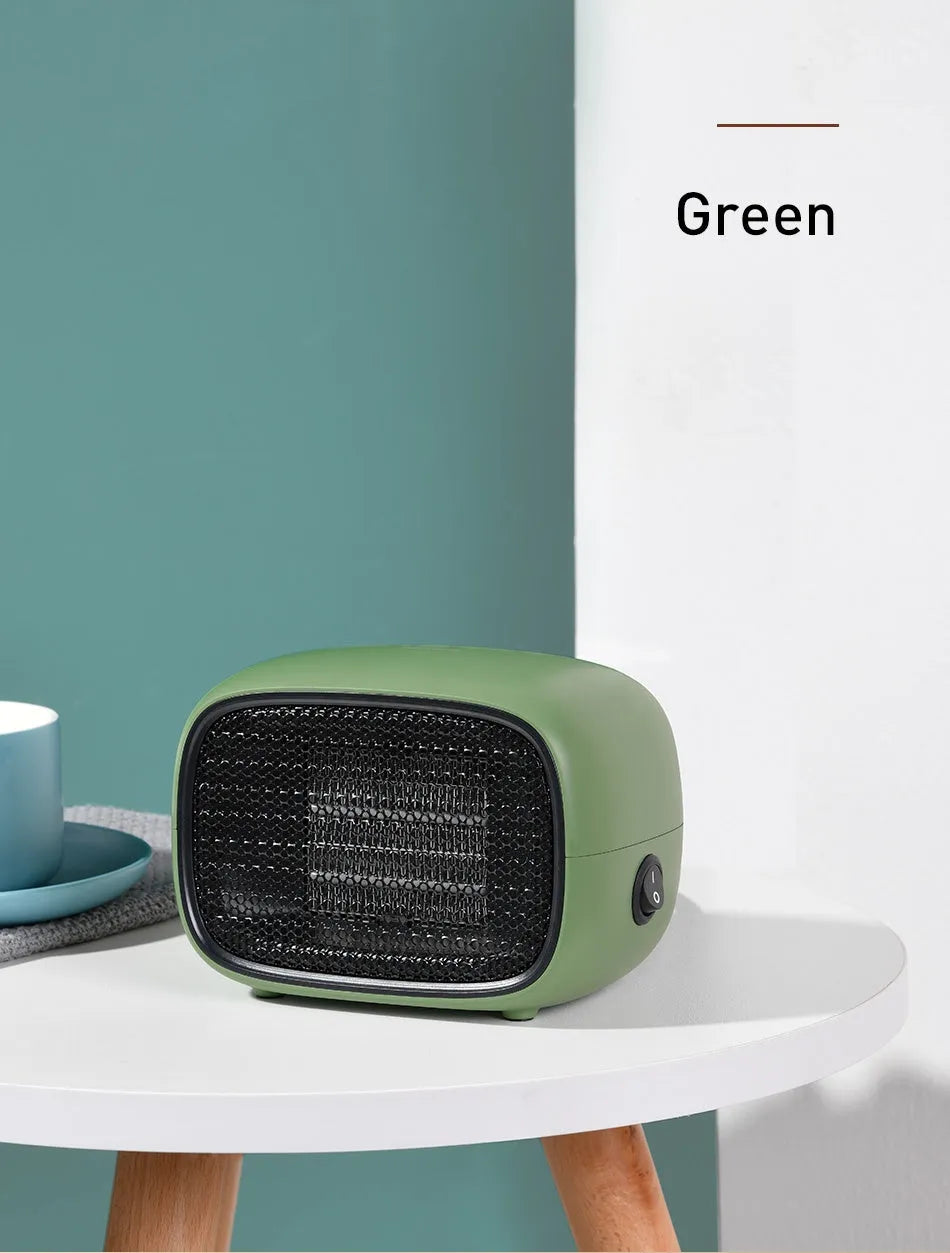Mini ceramic desk heater in green colour showing compact rectangular design with safety grille