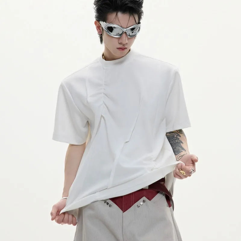 Men's grey cotton T-shirt with loose fit, round neck, and three-dimensional pleated detail on the front.