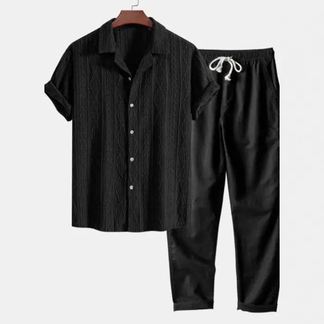 Man wearing a slim-fit short sleeve camouflage print shirt and matching trousers casual suit set.