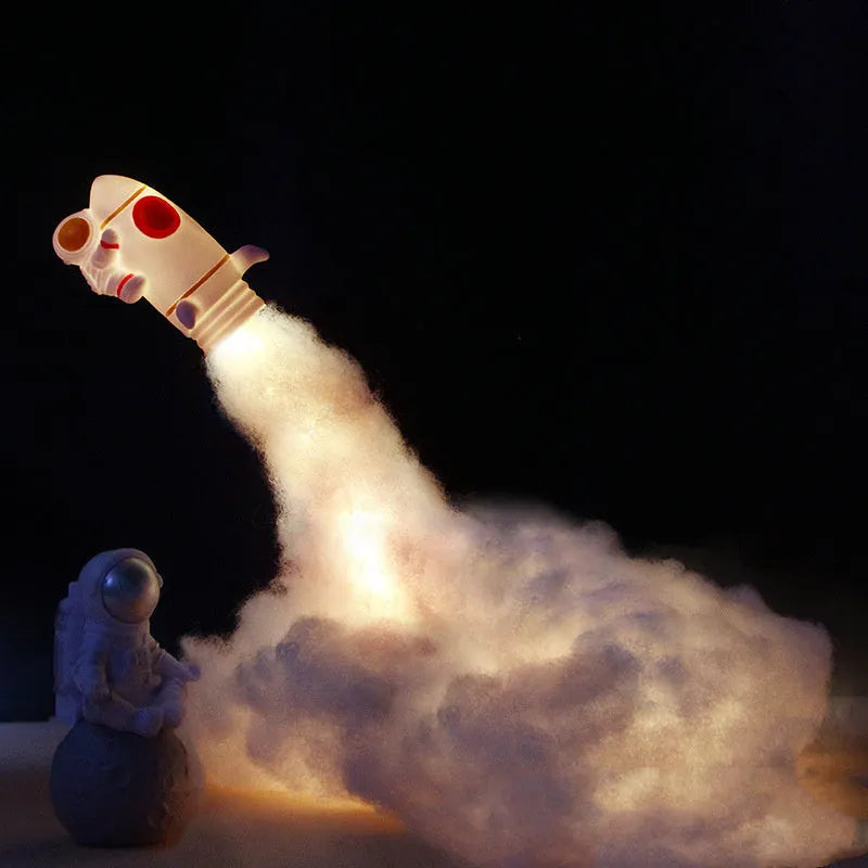 DIY astronaut rocket night light kit parts including plastic rocket, LED string, straws, and 19cm base