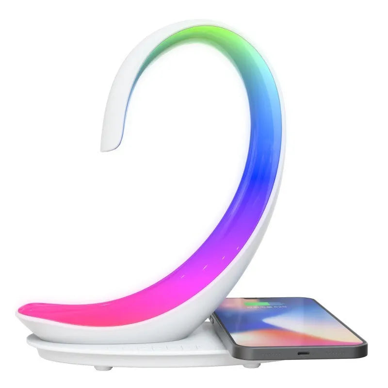 White swan shaped desktop lamp with wireless charging pad, Bluetooth speaker, and colourful LED lighting