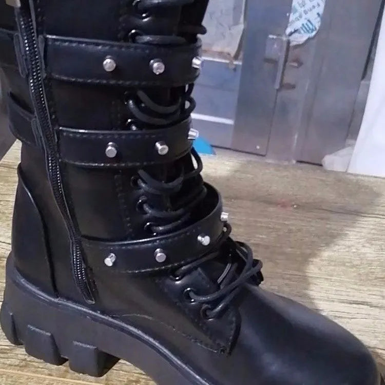 Black women's mid-calf boots with a large metal buckle and side zipper, featuring a round toe.