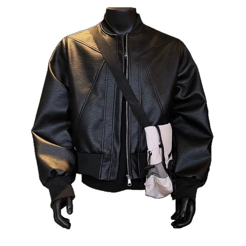 Man wearing a black PU egg white leather jacket with an extended length and tight light business fit.