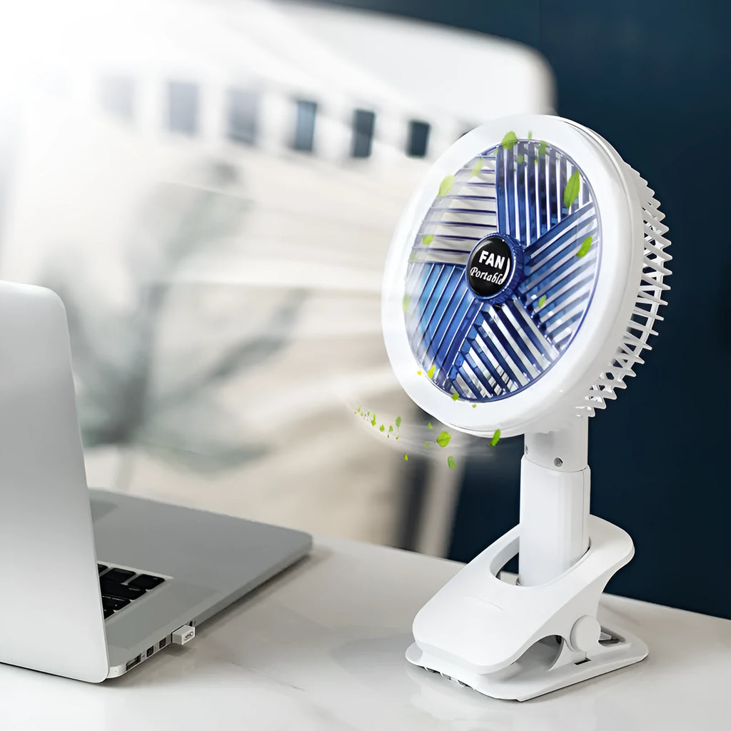 White and blue plastic rechargeable clip fan with USB cable, 29x18cm, clamped on a desk edge