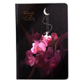 A5 notebook with luminous blue cover open to show colour illustration pages inside