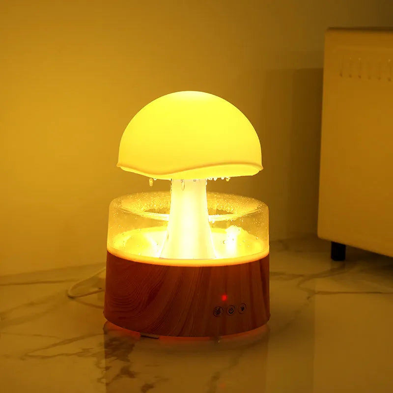 White cloud-shaped humidifier with LED lights and simulated rainfall, includes remote control
