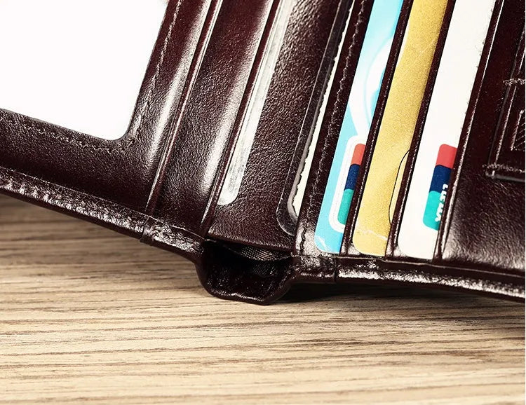 Men's leather wallet showing multiple compartments including banknote folder and card slots
