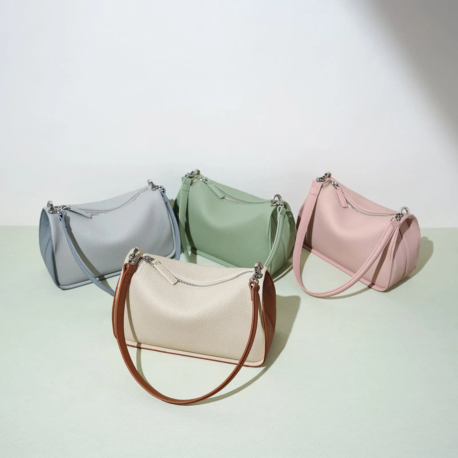 Women's first layer cowhide crossbody bag in pillow shape with double strap 23cm length milkshake white and brown