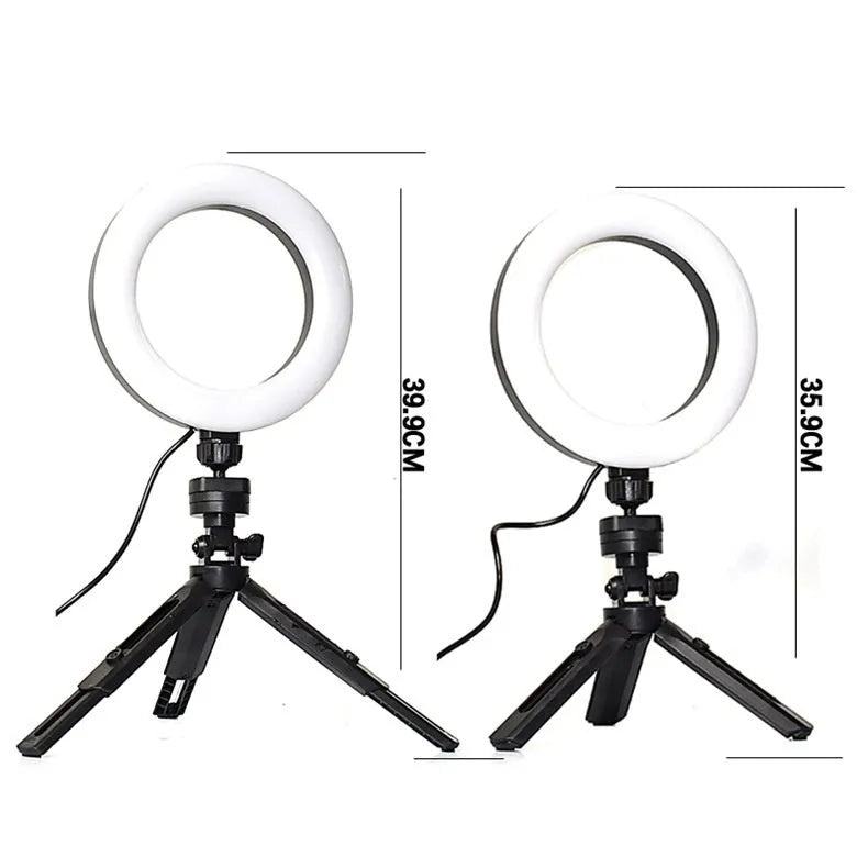 Black universal mobile phone bracket with adjustable fill light on a desktop tripod for live streaming.