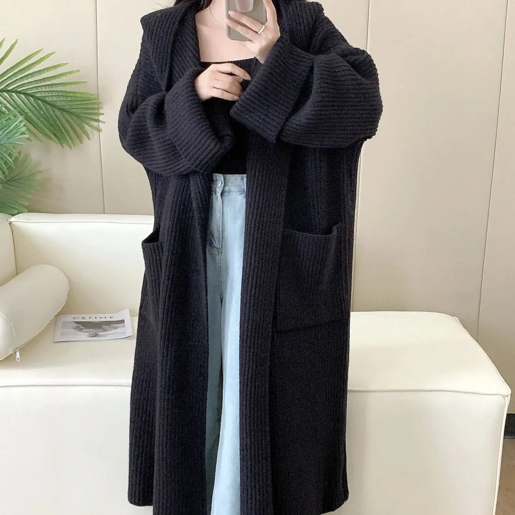 Women's loose-fitting hooded cardigan coat in acrylic fibre, shown in a neutral colour.