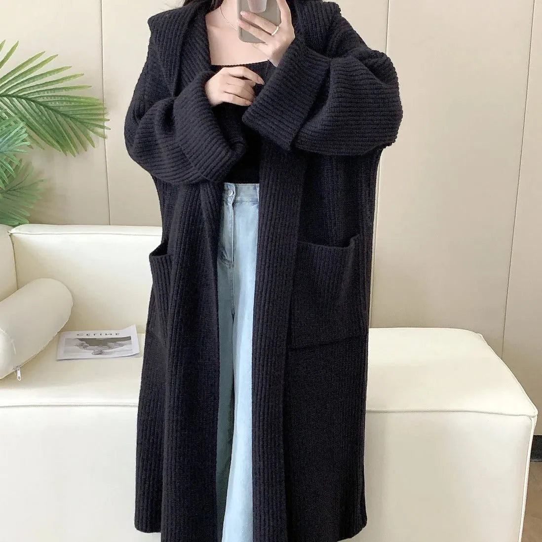 Women's loose-fitting hooded cardigan coat in acrylic fibre, shown in a neutral colour.