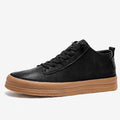 Men's black casual leather shoes with round toe and lace-up closure on white background