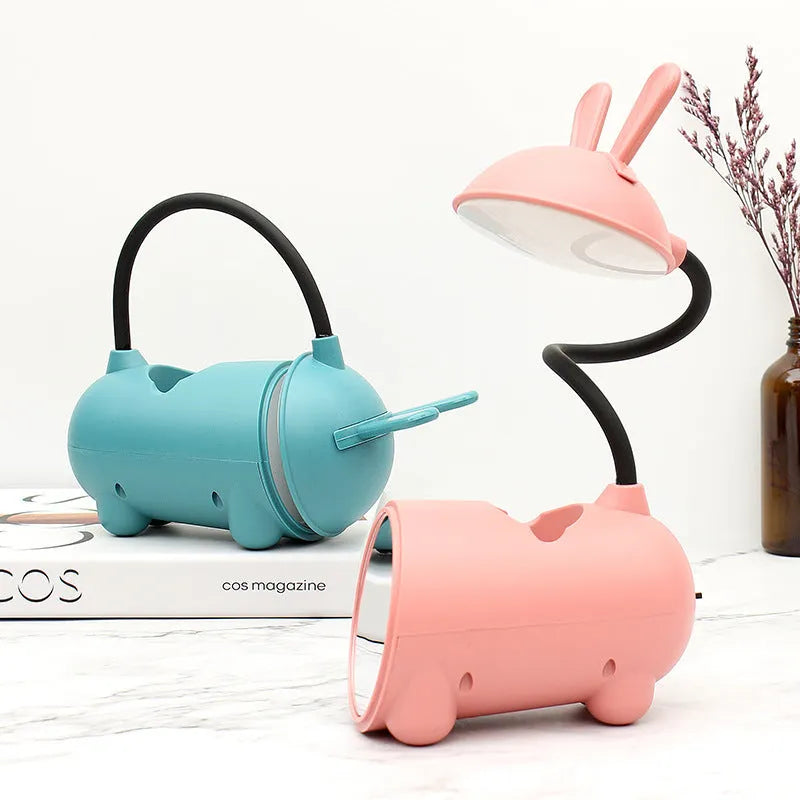 Green cartoon desk lamp with USB power and built-in pen holder container on desk