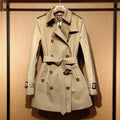 Khaki polyester women's trench coat with double-breasted front and flight sleeves
